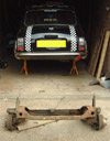 Mini Jacked up and Supported on Axle Stands with loose subframe